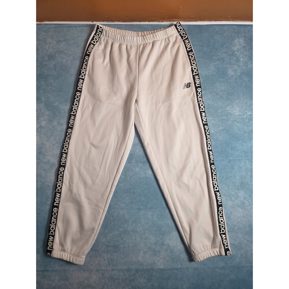 Modern New Balance Fleece Swearpants with repeat logo side taping. size small